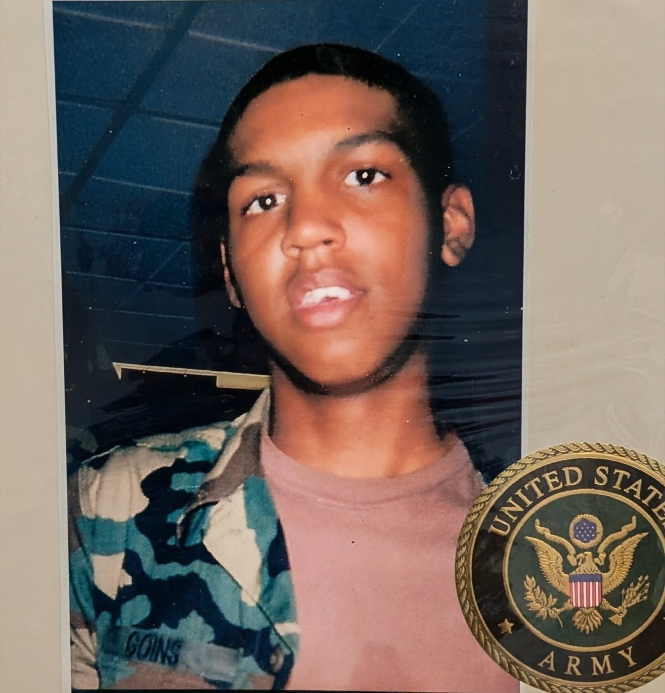 Kenny's U.S. Army portrait, Kenneth D. Goins, displayed with his Army service medallion