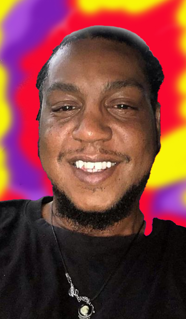 Kenny with a warm smile and a colorful backdrop