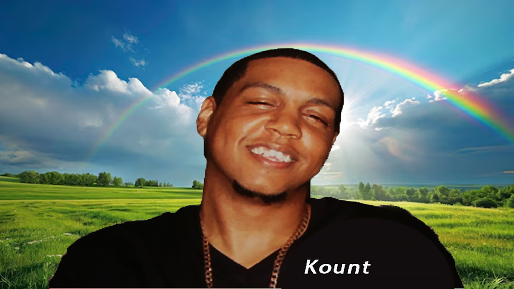 Kenny — known to all as Kount — smiling beneath a rainbow